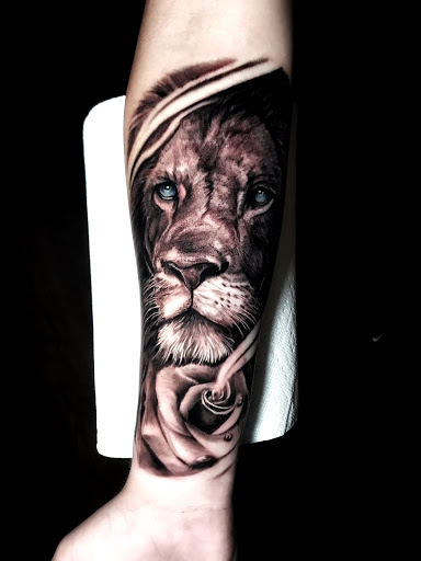 Explore tattoo thigh ideas, creative tattoo ideas in Johnson City, available at Gold Cross Tattoo Co.
