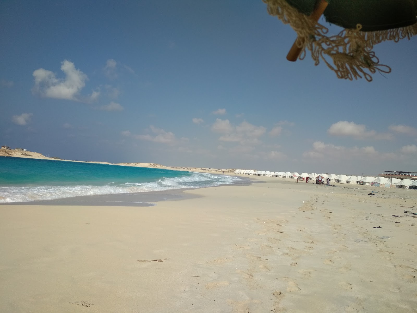 Photo of Bagosh Beach and the settlement