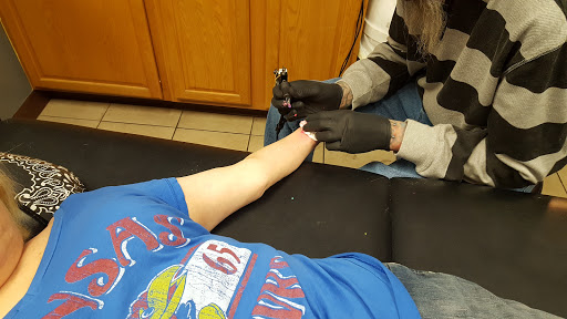 Explore small religious tattoo ideas, creative tattoo ideas in Lawrence, available at Skin Illustrations Tattoos & Piercings