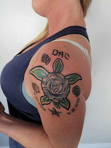 Explore small neck tattoo ideas, creative tattoo ideas in Tarpon Springs, available at Legendary Custom Tattoos and Piercings