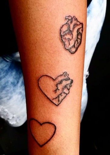 Find family symbol tattoo ideas for your next unique tattoo in Erie at EliKingInk
