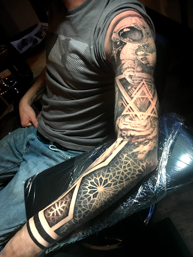 Explore simple spine tattoo ideas, creative tattoo ideas in Sunbury, available at Absinthe Tattoo