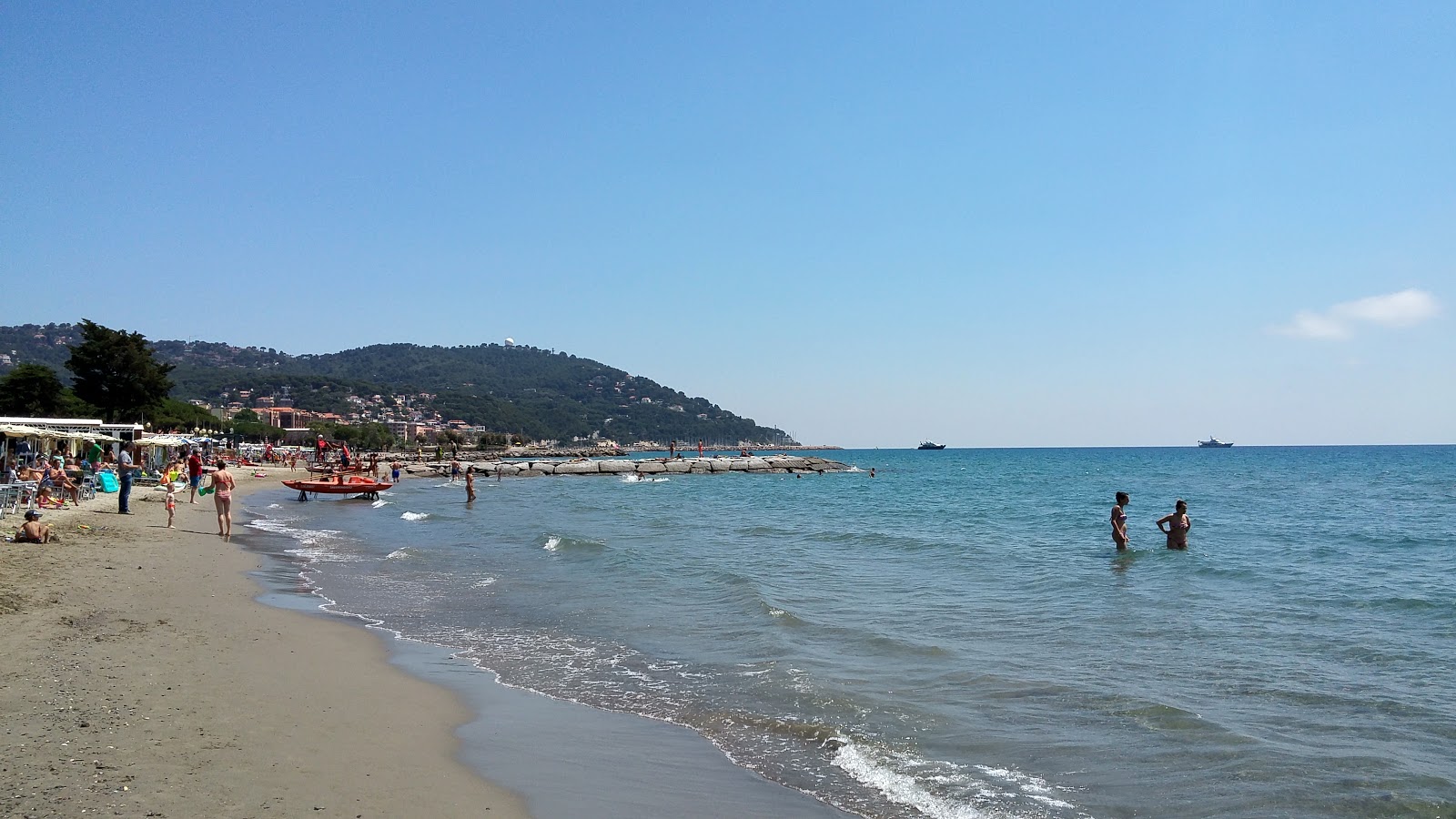 Photo of Andora beach II with brown sand surface
