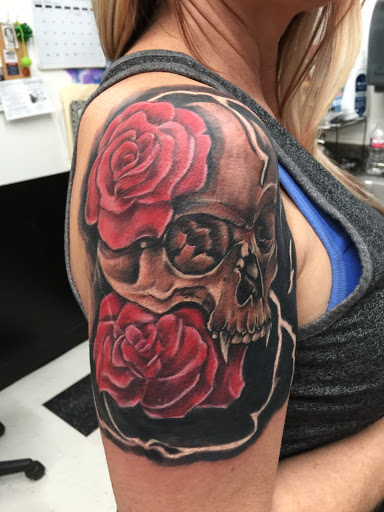 Explore back hand tattoo ideas, creative tattoo ideas in Lawton, available at Impact Ink Tattoo Studios