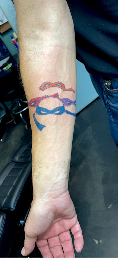Explore red ink tattoo ideas, creative tattoo ideas in Meridian, available at Creative Pain Tattoo Studio