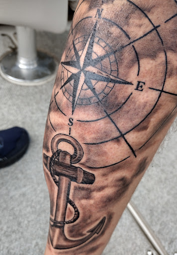 Explore sticker sleeve tattoo ideas, creative tattoo ideas in Watertown, available at Bare Knuckle Tattoo