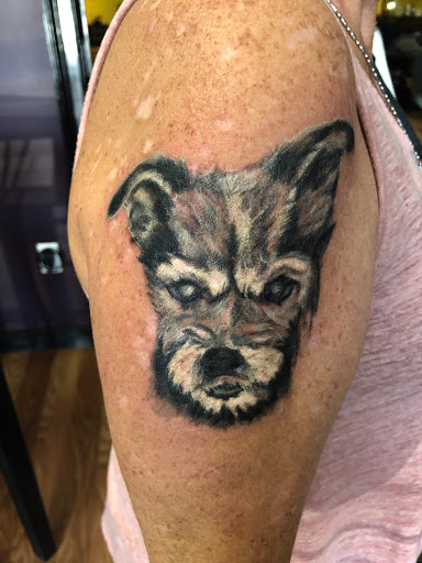 Explore inside bicep tattoo ideas, creative tattoo ideas in Covington, available at Cupid Slave Tattoo Company