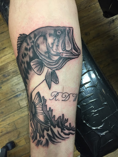 Explore behind ear tattoo ideas, creative tattoo ideas in Eureka Springs, available at Sailors Luck Tattoo