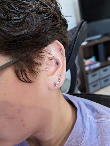 Explore neck tattoo ideas for woman, creative tattoo ideas in Plano, available at Studio Wren Fine Jewelry & Piercing