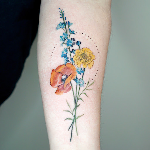 Find middle boob tattoo ideas for your next unique tattoo in Grand Rapids at Sparrows Nest Tattoo Studio