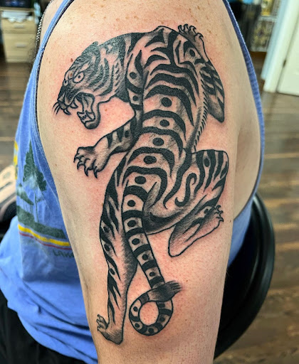 Explore hawaiian tattoo ideas for men, creative tattoo ideas in Delmar, available at Resolute Tattoo