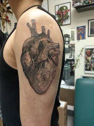 Explore tattoo ideas on the thigh, creative tattoo ideas in Saint Paul, available at Iron Rhino Tattoo