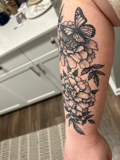 Explore tribal cover up tattoo ideas, creative tattoo ideas in Buford, available at Wild Tribe Tattoos and Piercings