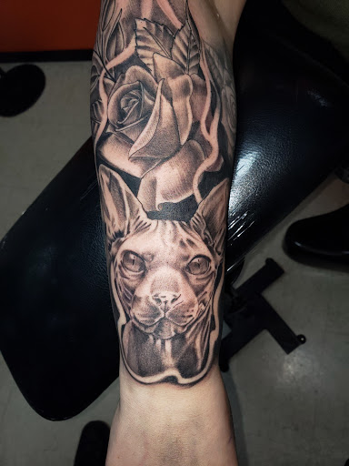 Explore arm tattoo ideas flowers, creative tattoo ideas in Sioux Falls, available at Outlaw Tattoos