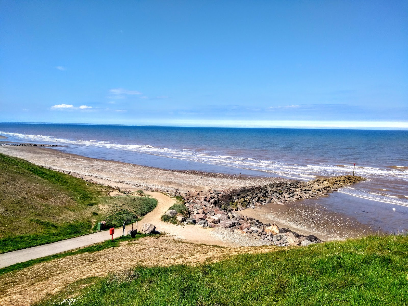 Foto di Spiaggia di Mappleton con una superficie del sabbia luminosa