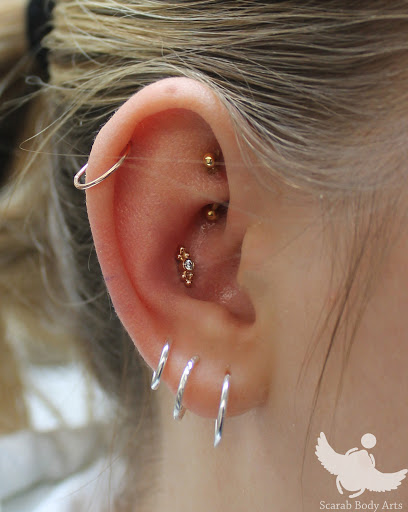 Explore calla lily tattoo ideas, creative tattoo ideas in Syracuse, available at Scarab Body Arts