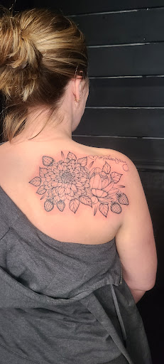 Explore purple rose tattoo ideas, creative tattoo ideas in Stevens Point, available at International Ink Tattoos
