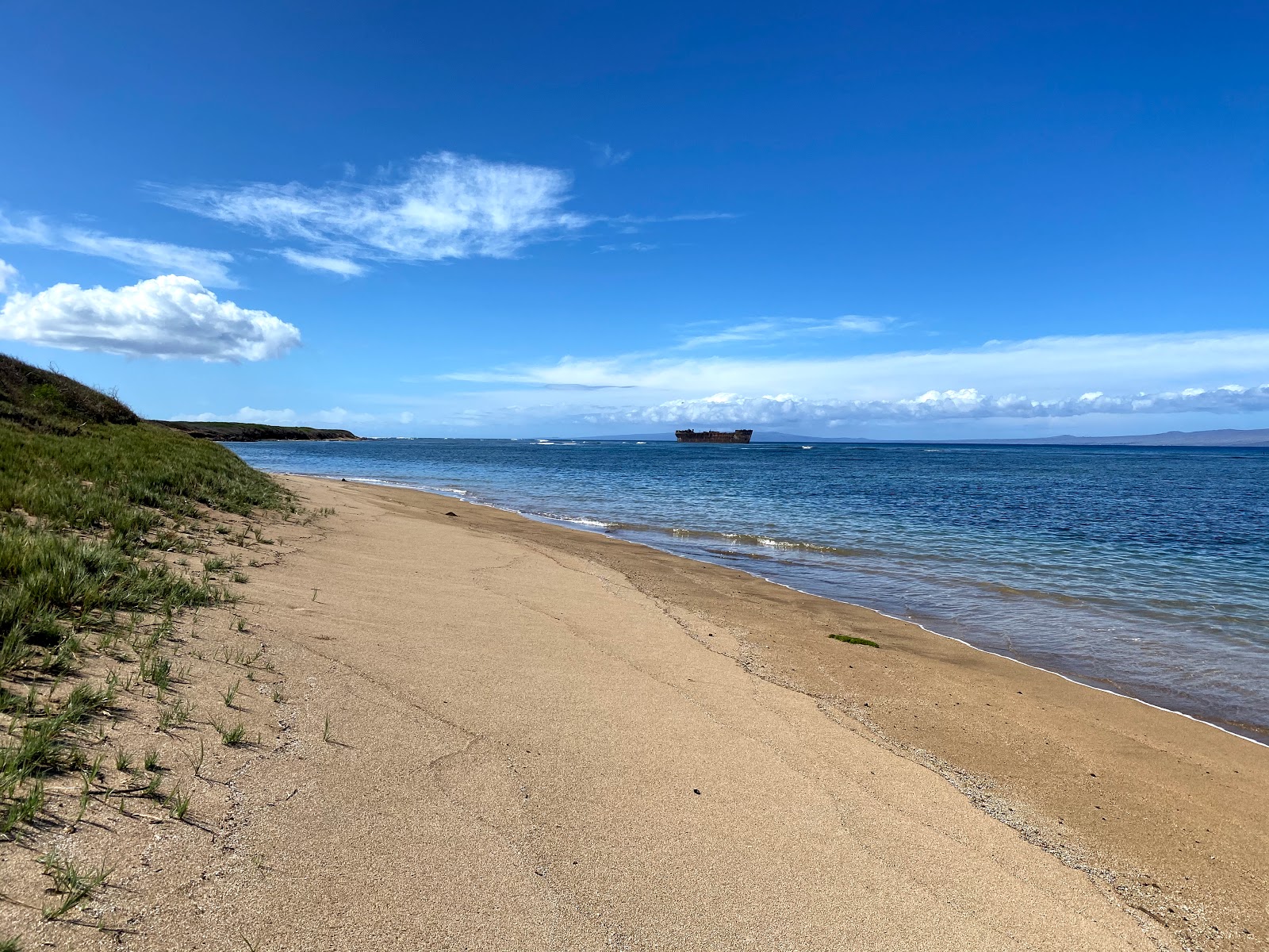 Foto von Shipwreck Beach mit türkisfarbenes wasser Oberfläche