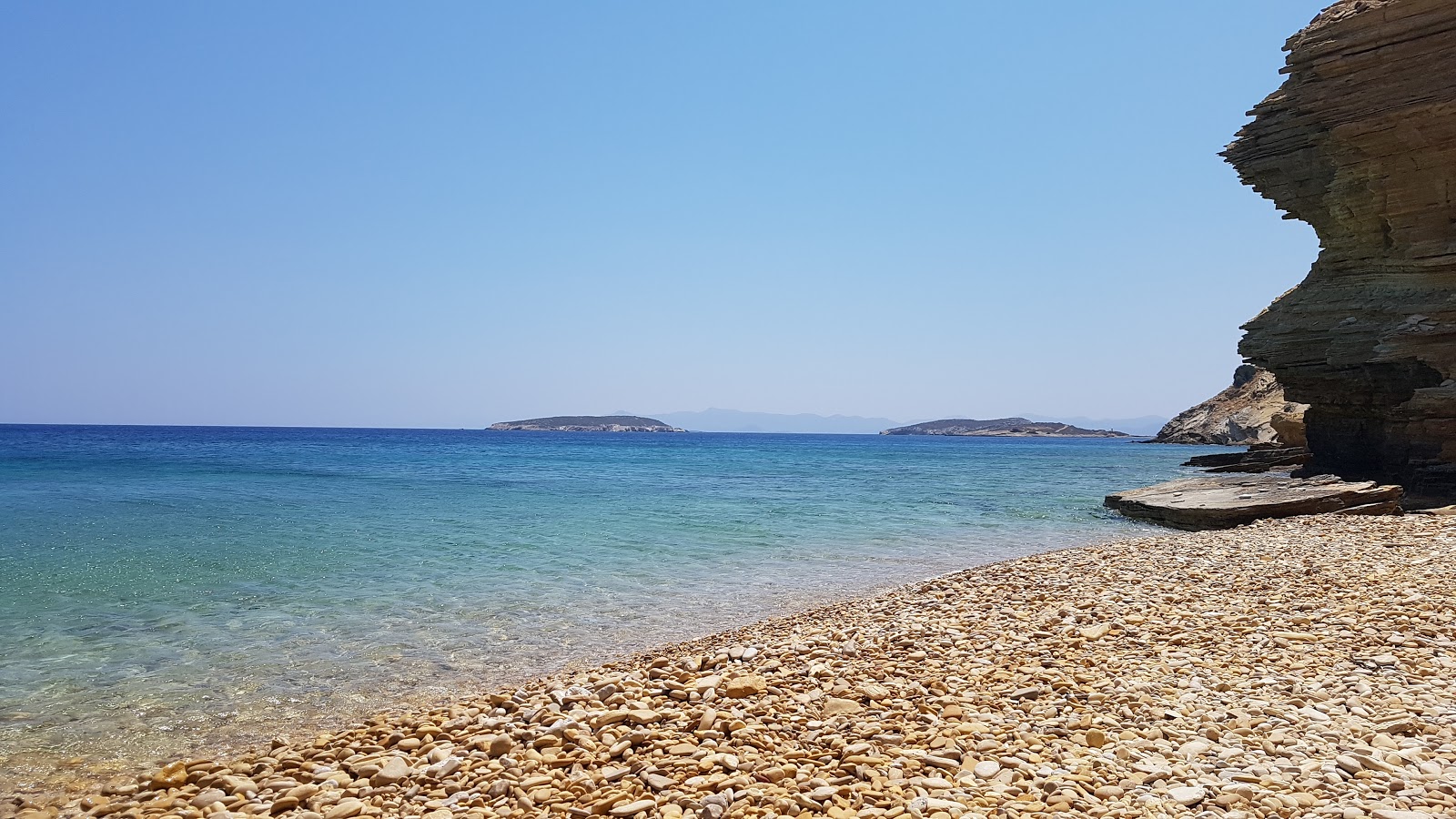 Foto von Monodendri beach II mit türkisfarbenes wasser Oberfläche