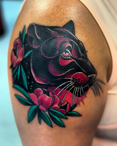 Explore dark skin male black skin tattoo ideas, creative tattoo ideas in Houston, available at Rose & Dagger Tattoo