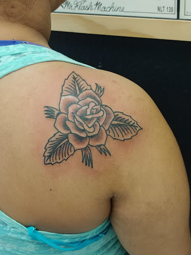 Explore thigh tattoo ideas for women, creative tattoo ideas in Georgetown, available at One Love Tattoos