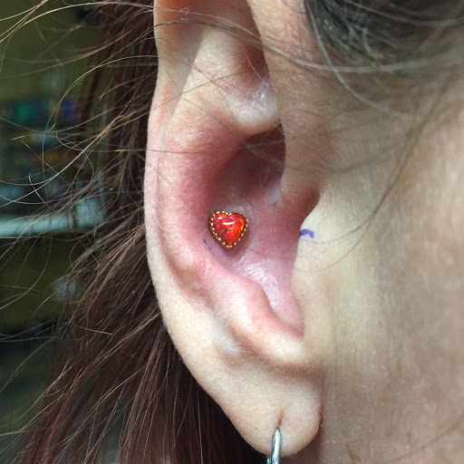 Explore tattoo ideas on side of stomach, creative tattoo ideas in Las Vegas, available at Primitive Accents Body Piercing