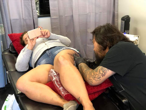 Explore mental health ribbon tattoo ideas, creative tattoo ideas in Fayetteville, available at Southern Customs Tattoo Company