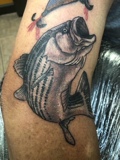 Explore wrap around wrist tattoo ideas, creative tattoo ideas in Okeechobee, available at Muck City Tattoos & Piercings