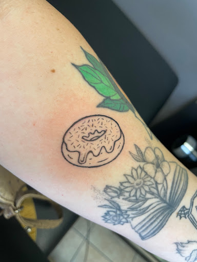 Explore lower sleeve tattoo ideas, creative tattoo ideas in Houston, available at 333 Tattoo Studio HTX