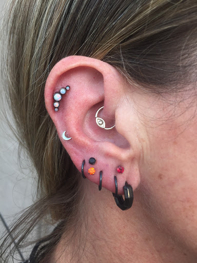 Explore ski tattoo ideas, creative tattoo ideas in Lexington, available at Alchemy Body Piercing