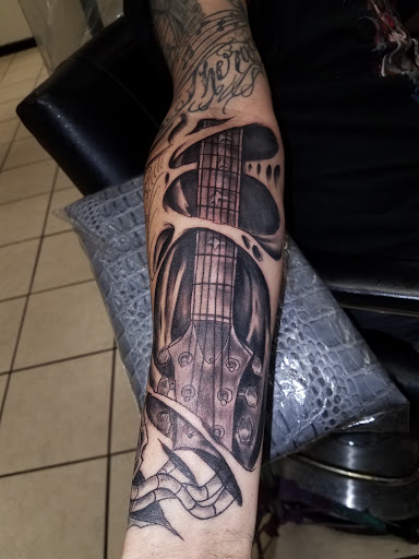 Explore ortiz tattoo ideas, creative tattoo ideas in Bowling Green, available at The Mad Tatter, L.L.C.