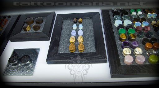 Explore 2 percent tattoo ideas, creative tattoo ideas in Dover, available at TATTOO MAFIA, INC.