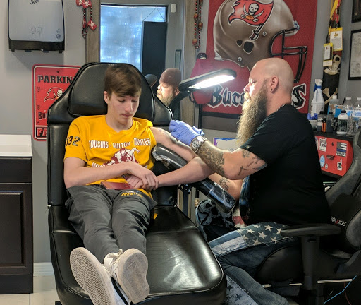 Explore 5sos tattoo ideas, creative tattoo ideas in Ocoee, available at Slaughterized Ink Tattoo and Piercing Studio