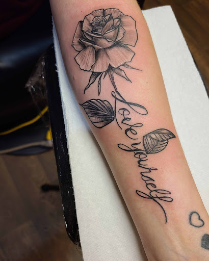 Explore reading tattoo ideas, creative tattoo ideas in Cumberland, available at Queen City Ink