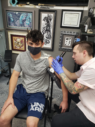 Explore ski tattoo ideas, creative tattoo ideas in Rockford, available at Delicious Ink Tattoo & Piercing