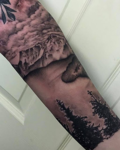 Explore last name tattoo ideas on arm, creative tattoo ideas in Kingsford, available at Deft Tattoo Studio