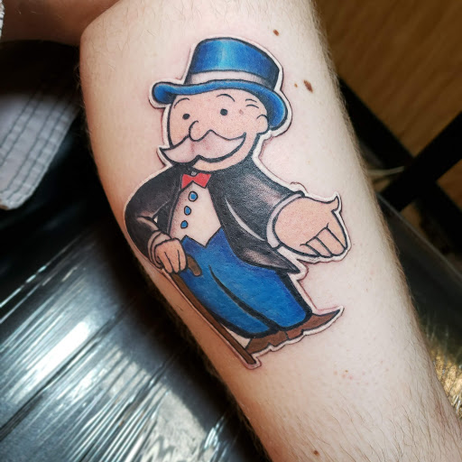 Explore leg tattoo ideas for men black, creative tattoo ideas in Washington, available at Artistic Underground Tattoo Studio