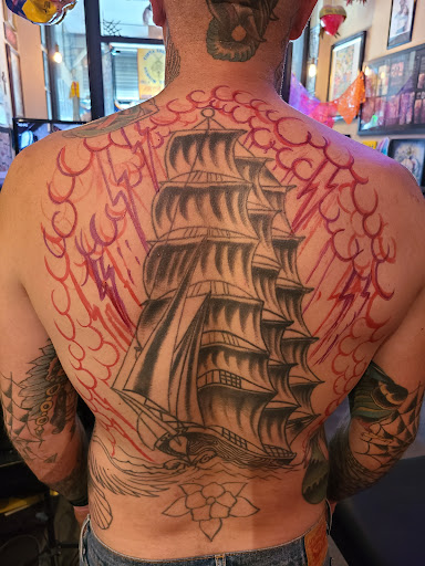 Explore tattoo ideas for happiness, creative tattoo ideas in Los Angeles, available at Tinta Rebelde hardcore tattoo