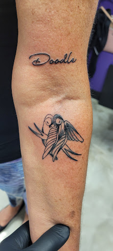 Explore spartan helmet tattoo ideas, creative tattoo ideas in Riverview, available at Alchemy Tattoo Exchange