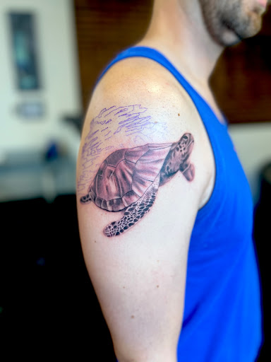 Explore last name back tattoo ideas, creative tattoo ideas in Washington, available at Fattys Tattoos & Piercings Dupont Circle