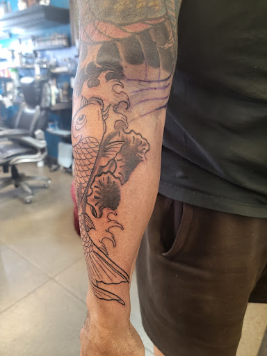 Explore patchwork sleeve tattoo ideas, creative tattoo ideas in Elk River, available at Ink Kings Tattoo