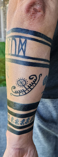 Explore ferret tattoo ideas, creative tattoo ideas in Cadillac, available at Limitless Ink Tattoo Studio