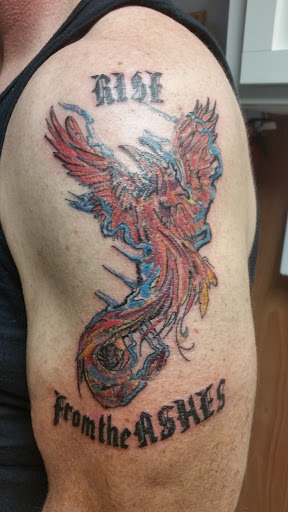 Explore tattoos for your son ideas, creative tattoo ideas in Cumberland, available at Queen City Ink