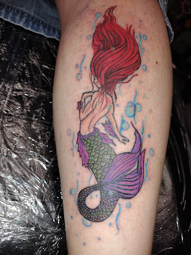 Explore back tattoo ideas male, creative tattoo ideas in Park Hills, available at Sideshow Tattoo and Piercings