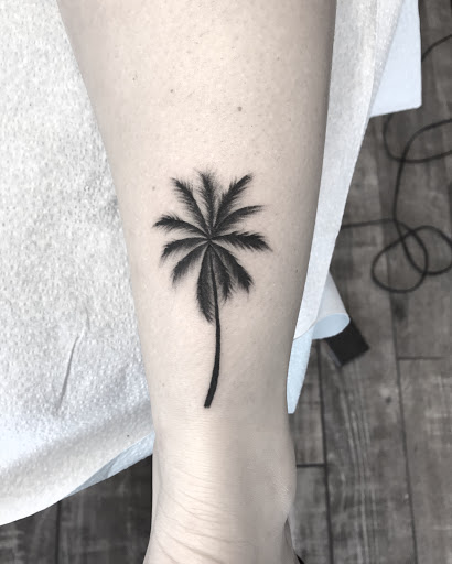 Find christmas tattoo ideas for your next unique tattoo in Lakeland at Black Swan Tattoo