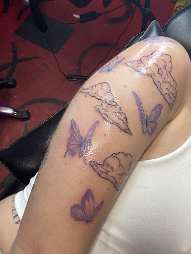 Explore barbed wire tattoo cover up ideas, creative tattoo ideas in Stuart, available at Kenny Tats Inkcorporated