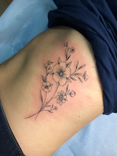Explore women's sternum tattoo ideas, creative tattoo ideas in Glenside, available at Iron Will Tattoo Club