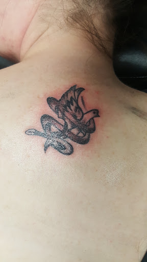 Explore back of the arm tattoo ideas, creative tattoo ideas in Broken Arrow, available at Just Another Hole