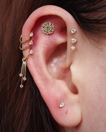 Explore tattoo ideas for female sleeve, creative tattoo ideas in Seattle, available at Bury Me In Gold Body Piercing