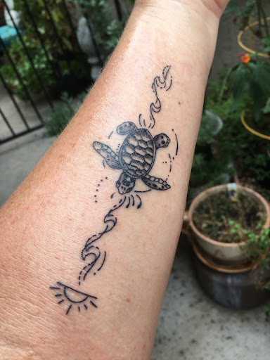 Explore half sleeve tattoo ideas for females, creative tattoo ideas in San Diego, available at Sideshow Tattoo and Piercing